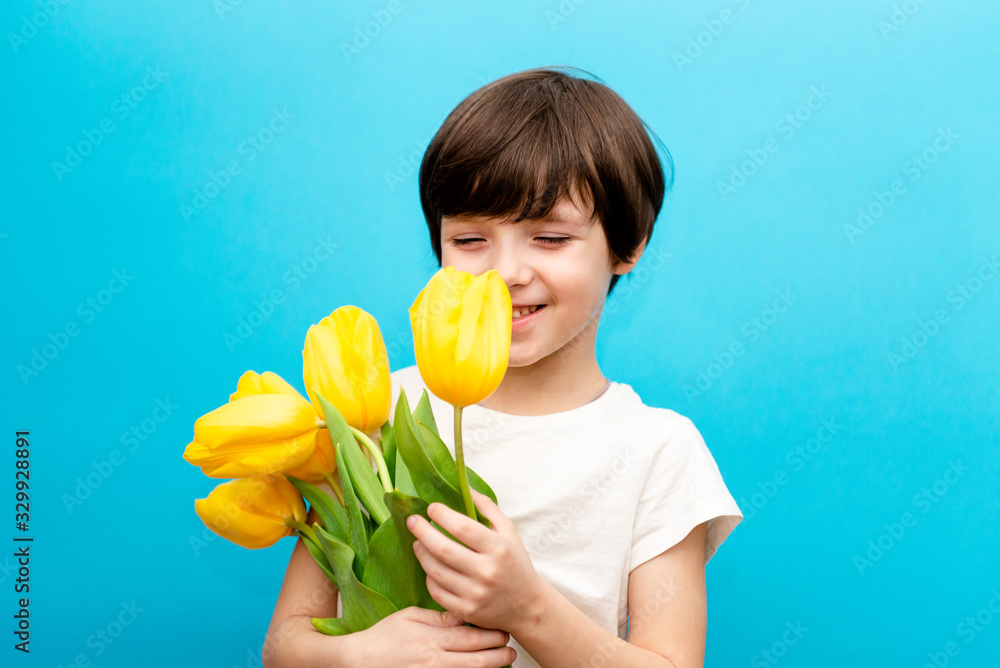 Portrait Smiling Boy with Yellow Bouquet Tulips for Mom Spring Flowers Concept Mother's Day Valentines Gift for Woman Portrait Smiling Boy with Yellow Bouquet Tulips for Mom Spring Flowers Concept Mother's Day Valentines Gift for Woman