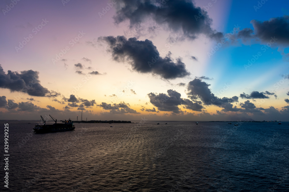 Malé, Maldives - December 27 2019 - Colorful sky at twilight Malé, Maldives - December 27 2019 - Colorful sky at twilight