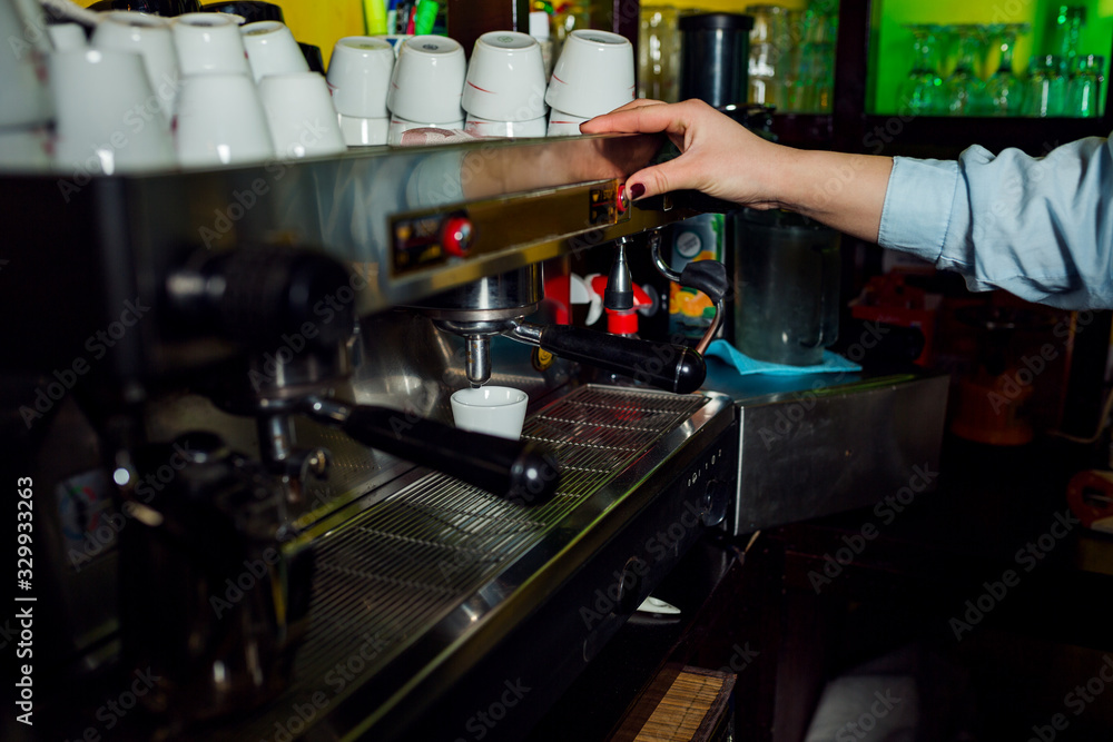 Unrecognizable woman make coffee at coffee machine