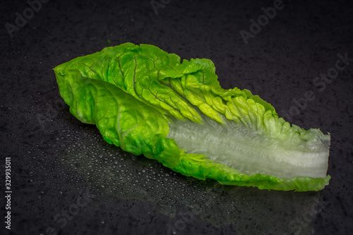 green lettuce on black background photo