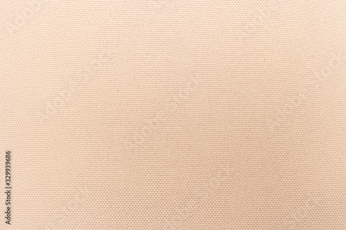 Cream abstract Hessian or sackcloth fabric or hemp sack texture background. Wallpaper of artistic wale linen canvas. Blanket or Curtain of cotton pattern with space for text decoration. Seamless cream