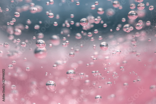 bubbles chemical liquid pink macro. chemical reaction in living organisms harmful to helium and methane in liquid states