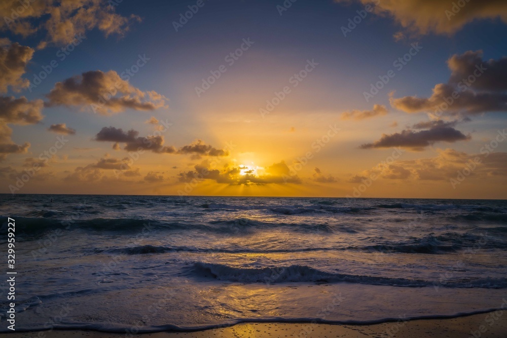 sunset ocean sea sand beach sun sunrise water sky orange cloud waves horizon beautiful miami florida coast