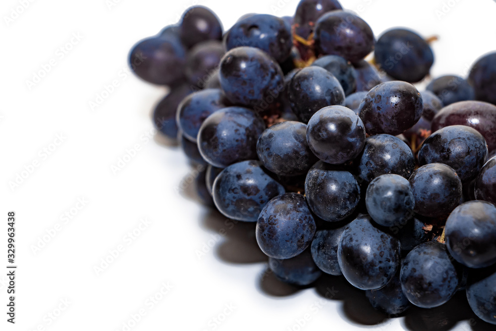 Bunches of dark grapes isolated on white background Bunches of dark grapes isolated on white background