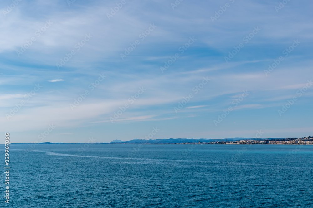 The panoramic view of the Mediterranean Sea and the hazy landscape on the horizon on a sunny day (Provence Côte d'Azur, France)