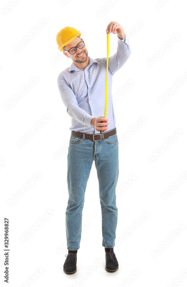 Male engineer with tape measure on white background Male engineer with tape measure on white background
