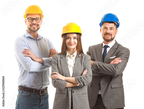 Group of engineers on white...