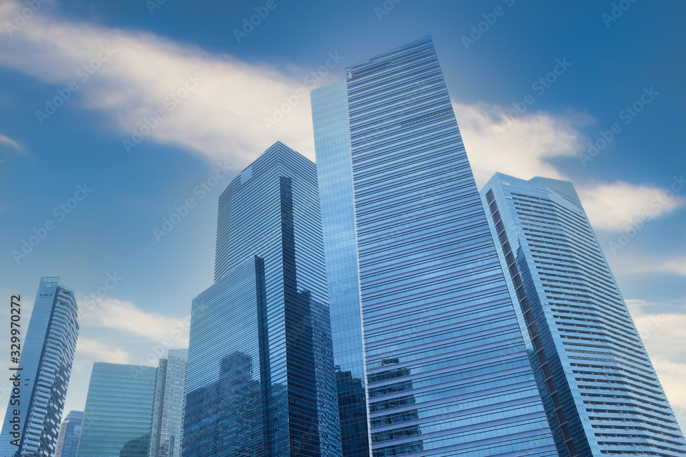 low angle view of singapore financial buildings at morning low angle view of singapore financial buildings at morning