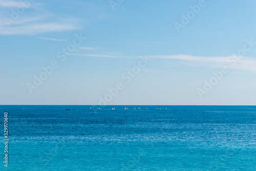 The panoramic view of the turquoise water of the Mediterranean Sea and the white boats in the distance on the horizon on a sunny day  Provence C  te d Azur  France 