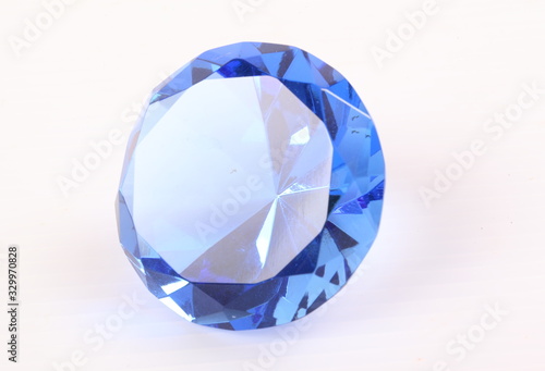 Blue diamond on white surface