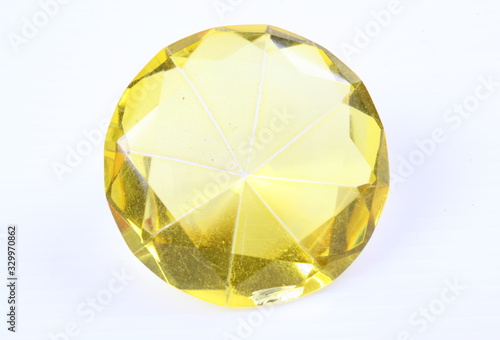 Yellow diamond on white surface