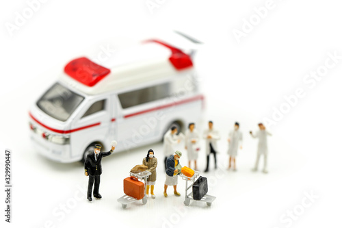Miniature people : Doctor team with Ambulance, coronavirus covid 19 infected patient caution outbreak alert.