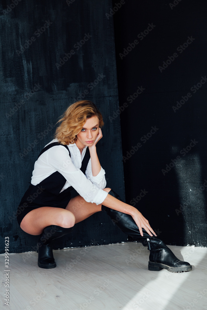 Portrait of a beautiful fashionable stylish woman in clothes poses Portrait of a beautiful fashionable stylish woman in clothes poses