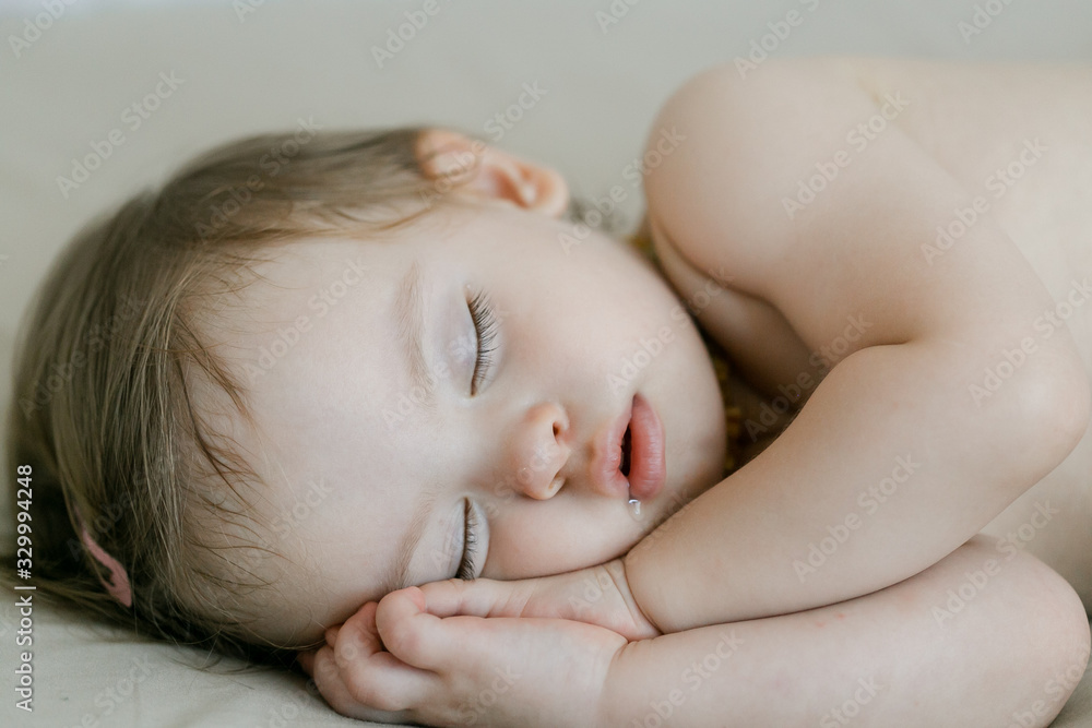 cute infant baby girl sleeping in bed. top view cute infant baby girl sleeping in bed. top view