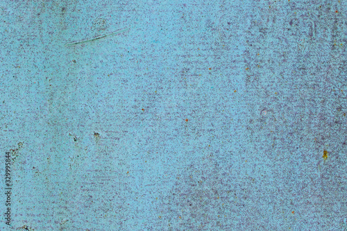 Wall with layer of paint. French Pass color, shade of blue. Spot rust, defects, scratches.