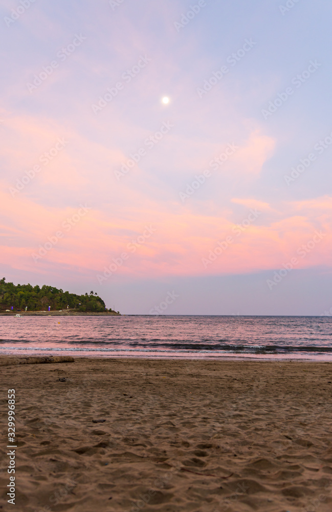 Sunset over the water at Corbyns Cove Beach in Port Blair, Andaman and Nicobar Islands, India a late evening during the festival. 