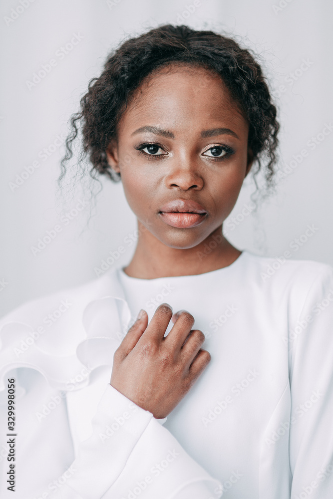 Minimalistic wedding series in European style. Stylish African bride. Concept and idea of a white wedding. Minimalistic wedding series in European style. Stylish African bride. Concept and idea of a white wedding.