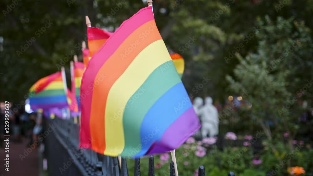 LGBTQ flags on the Christopher Park fence during 50th anniversary of the Stonewall riots, Greenwich Village NYC, day time LGBTQ flags on the Christopher Park fence during 50th anniversary of the Stonewall riots, Greenwich Village NYC, day time