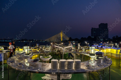 Dinner buffet on a cruise ship near Rama VIII Bridge On the Chao Phraya River