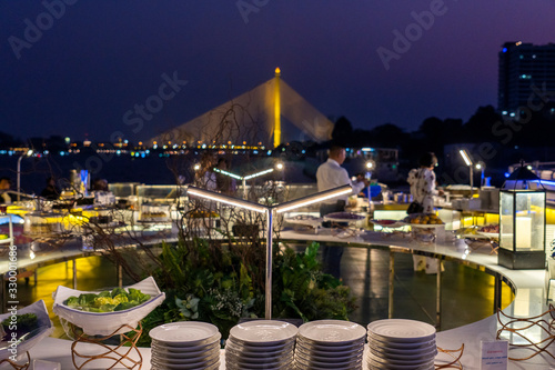 Dinner buffet on a cruise ship near Rama VIII Bridge On the Chao Phraya River