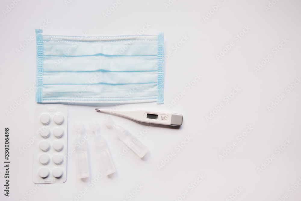 electronic thermometer with protective mask and medicine