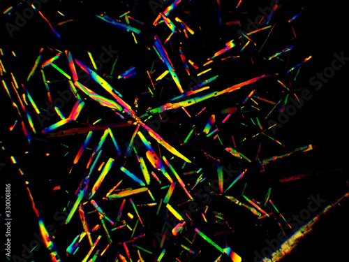 Crystal layer on microscope object glass  seen in polarized light. This causes random unforeseeable color effects.