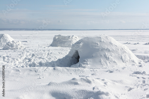 Igloo  standing on a snowy  reservoir in the winter, Novosibirsk, Russia