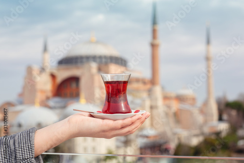 A glass of Turkish tea on the background of Hagia Sophia