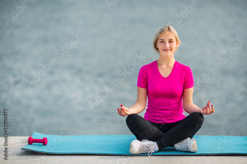 beautiful young woman in sportswear in summer