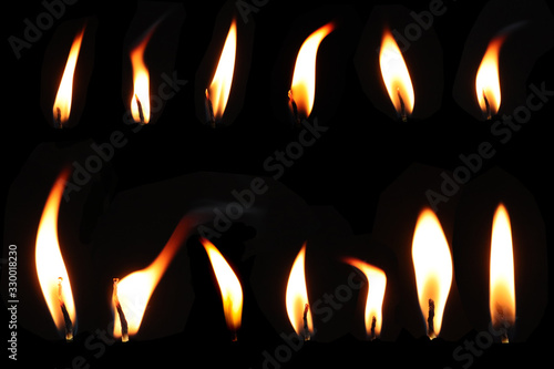  Set of fire flame. Realistic candle flame isolated on black background.