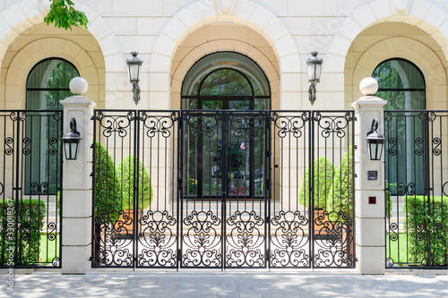 Photography View of gateway and wall of a beautiful old english mansion