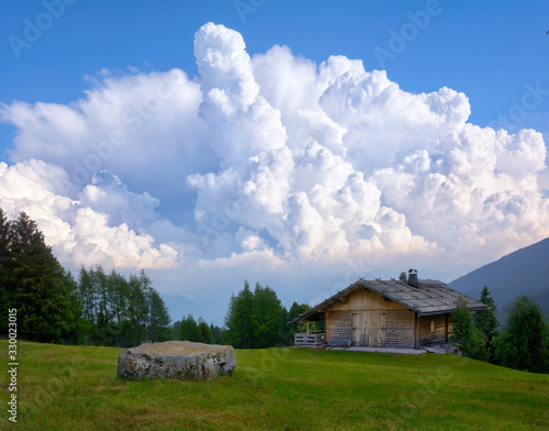 Landscape of the mountain hut. Summit house view. Mountain hut in summer. Deciduous mountain view