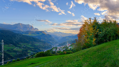 View from the Villanders village south overlooking the valley and village to the Eisacktal valley and themountain sciliar on a bright autumn day.