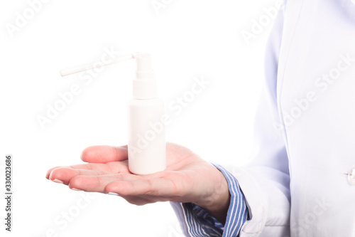 Doctor hand in sterile gloves holding spray isolated on white background - Image