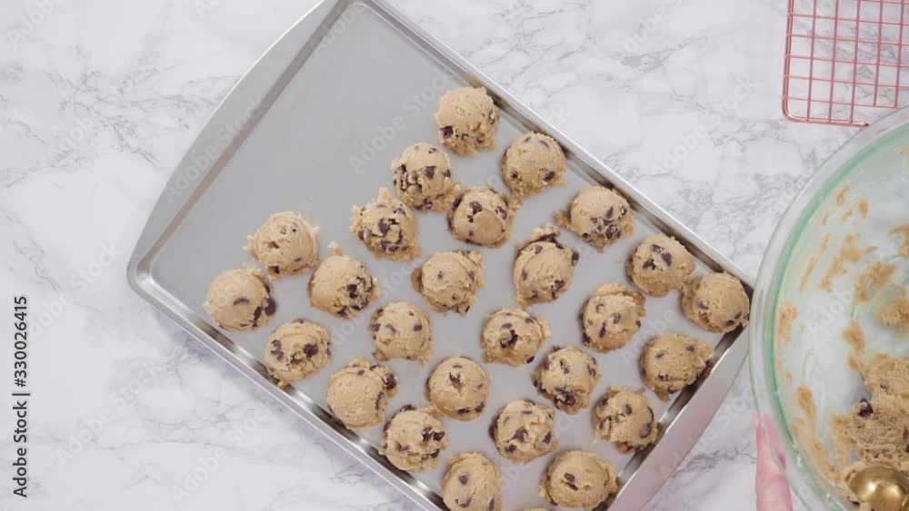 Step by step. Flat lay. Scooping homemade chocolate chip cookies with metal dough scoop to the baking sheet. Step by step. Flat lay. Scooping homemade chocolate chip cookies with metal dough scoop to the baking sheet.