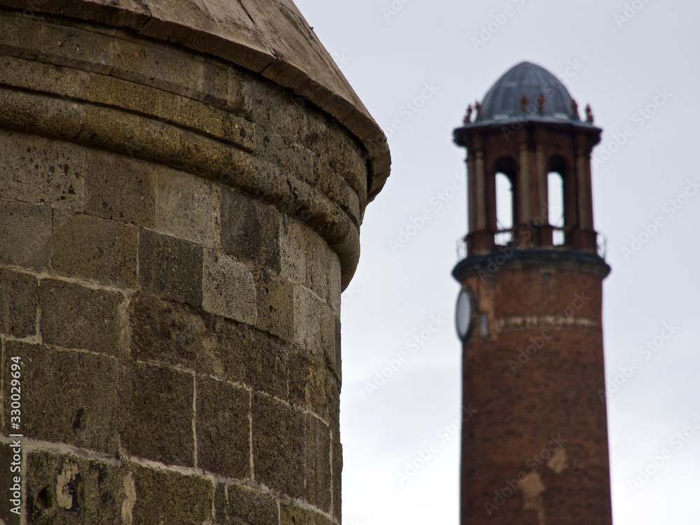 Historical Erzurum fortress and clock tower. Historical cupola Seljuk tombs.