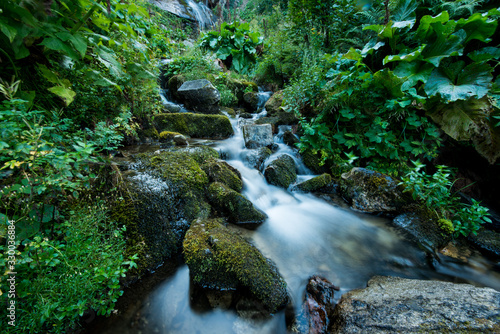 Scenic creek in the green Carpathian mountains, long exposure