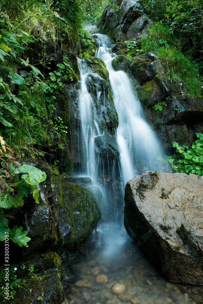 Scenic waterfall in the green Carpathian mountains