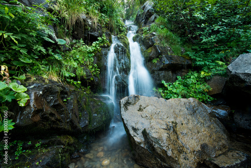 Scenic waterfall in the green Carpathian mountains
