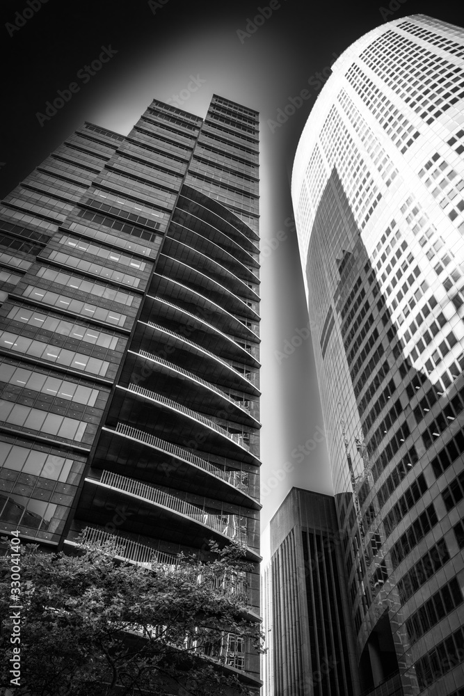 Fototapeta premium Low angle perspective view in black and white of some major landmarks in Sydney CBD, Australia.