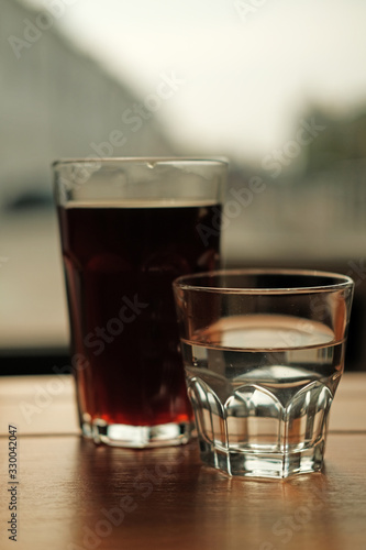 Stylish served specialty alternative black coffee. Filter pour-over coffee served in crystal glass and decanter. Aesthetics coffee