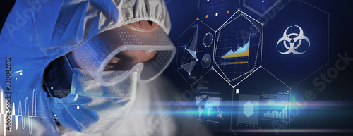 science, technology and pandemic concept - close up of scientist in goggles and protective mask over virtual projections with worldwide biohazard caution on dark blue background