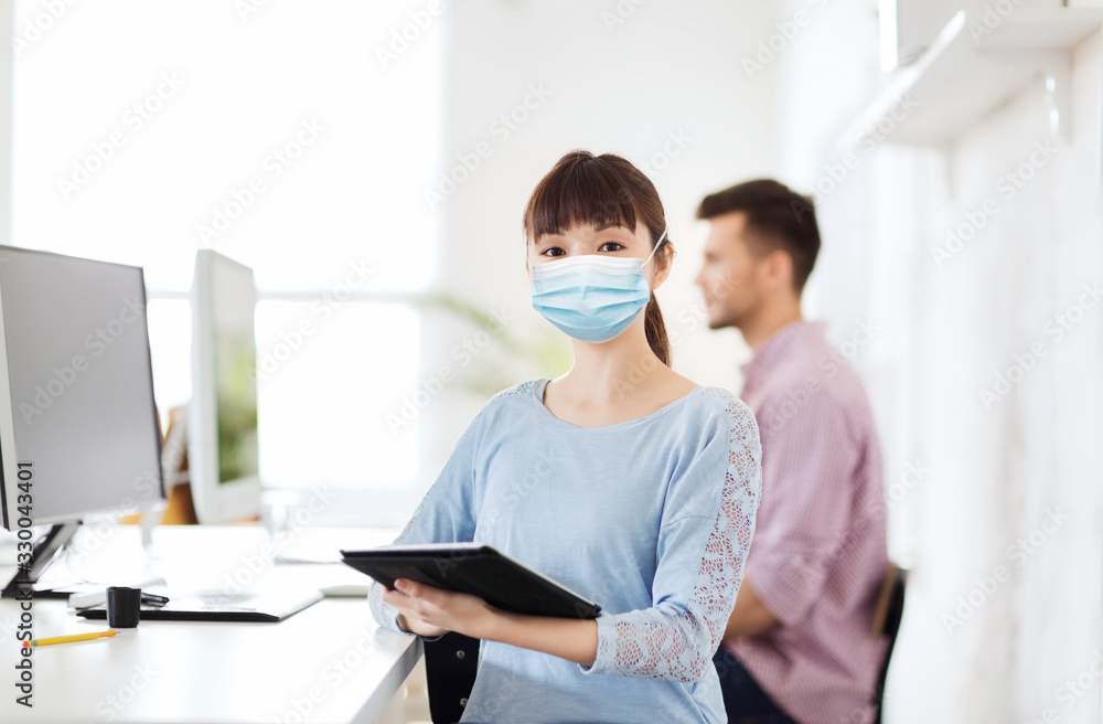 Obraz premium health, safety and pandemic concept - asian young woman wearing protective medical mask for protection from virus disease at office