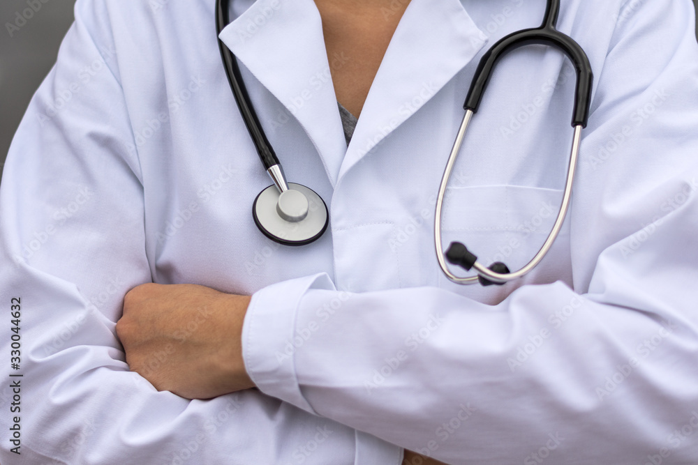 Biology and science. Close-up of young female doctor with stethoscope. Biology and science. Close-up of young female doctor with stethoscope.