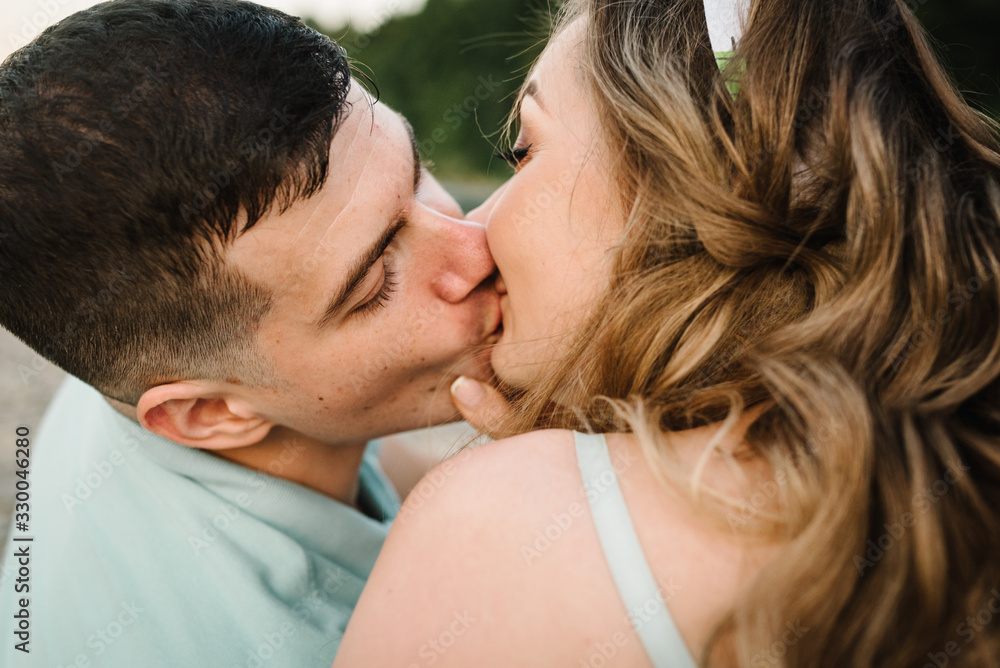 Loving couple kissing in nature. Kiss. Love. Close up. Loving couple kissing in nature. Kiss. Love. Close up.