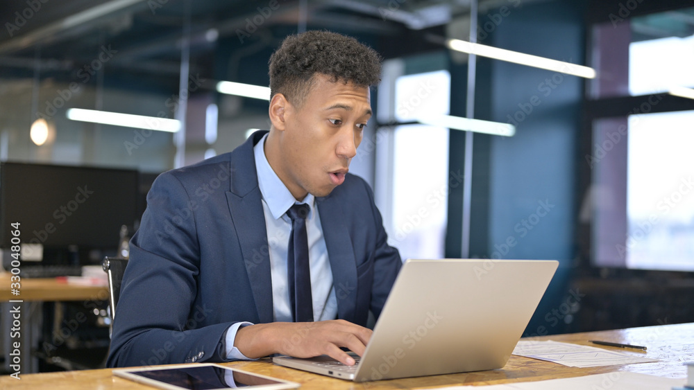 Young Businessman feeling Shocked in Office