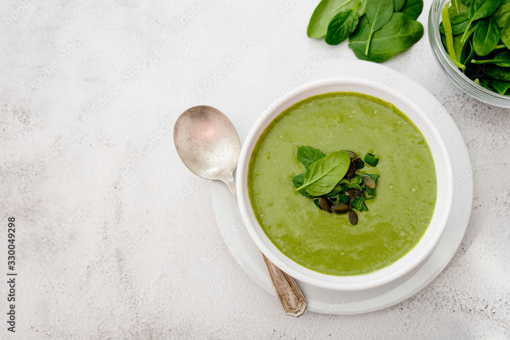 Creamy vegetable soup on bright table. Healthy detox food. Vegetarian food. Creamy vegetable soup on bright table. Healthy detox food. Vegetarian food.