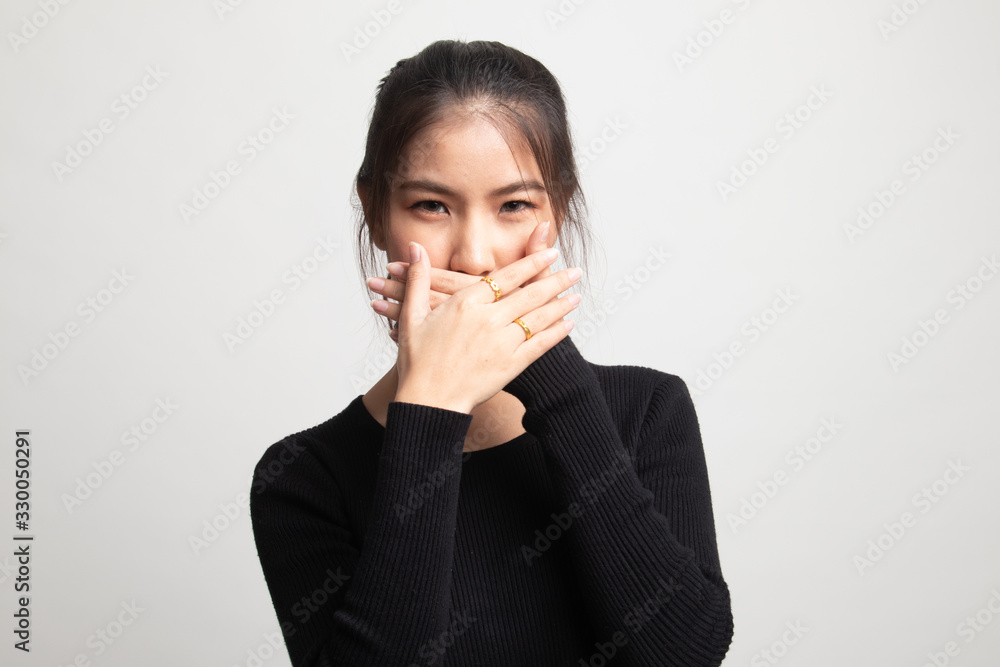 Beautiful young Asian woman close her mouth. Beautiful young Asian woman close her mouth.