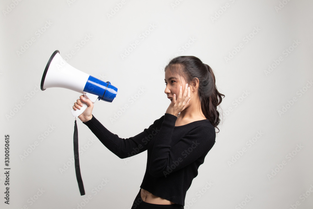 Beautiful young Asian woman announce with megaphone. Beautiful young Asian woman announce with megaphone.