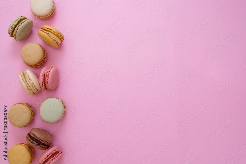 Colorful abstract pink background with french macaroons cookies, copy space. Feminine or beauty background. Colorful abstract pink background with french macaroons cookies, copy space. Feminine or beauty background.